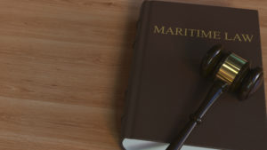 Court gavel on MARITIME LAW book